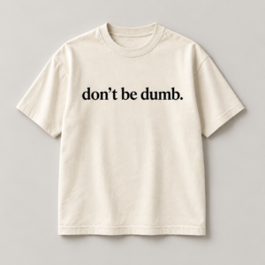 Front of the bone don’t be dumb. The Message Remains Tee '26 Limited Edition with black serif chest lettering